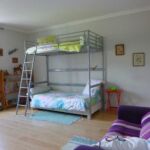 Chambre Papillon avec lits superposés et canapé-lit au premier étage